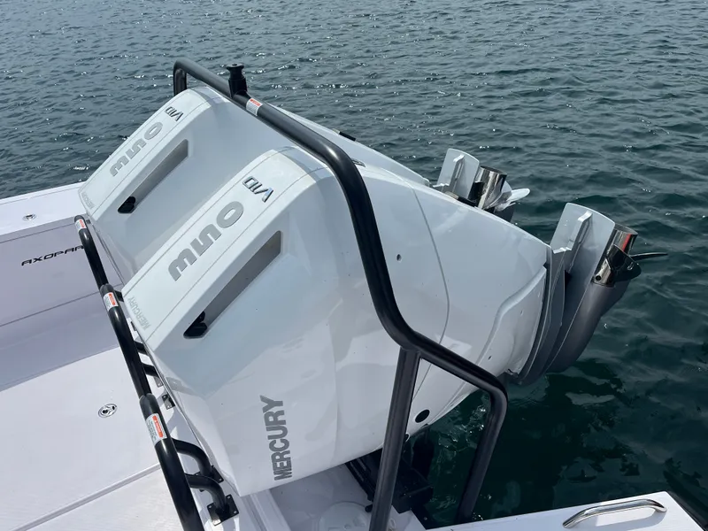 Slide: The Image of Two Mercury outboard engines on an Axopar 37 XC Cross Cabin boat. - 2