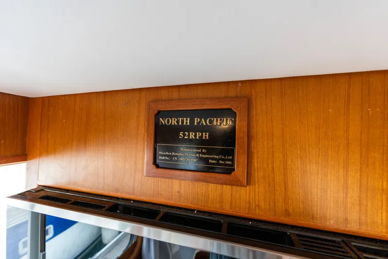 Slide: The Image of Plaque on North Pacific 52 yacht, manufactured December 2006, mounted on wooden interior. - 38
