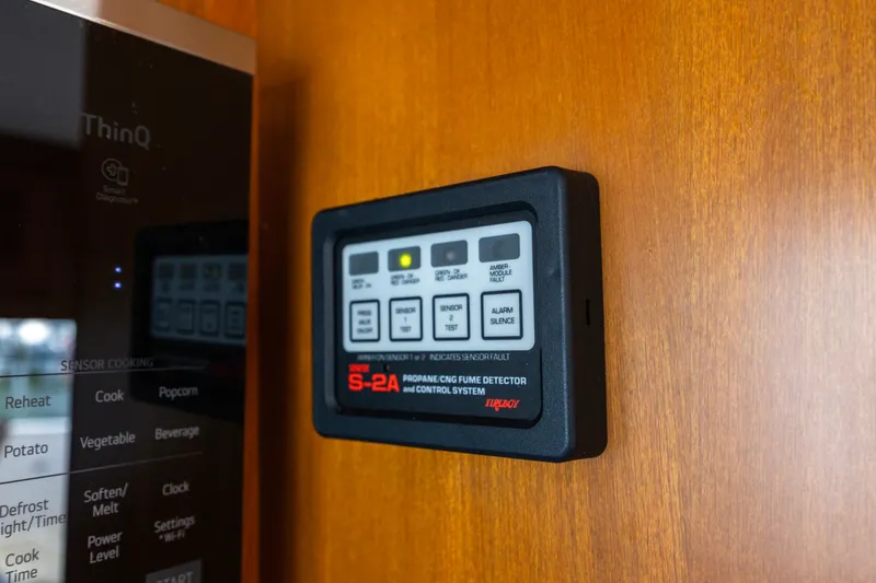 Slide: The Image of Propane fume detector on 2006 North Pacific 52 yacht interior, mounted on wooden panel. - 39