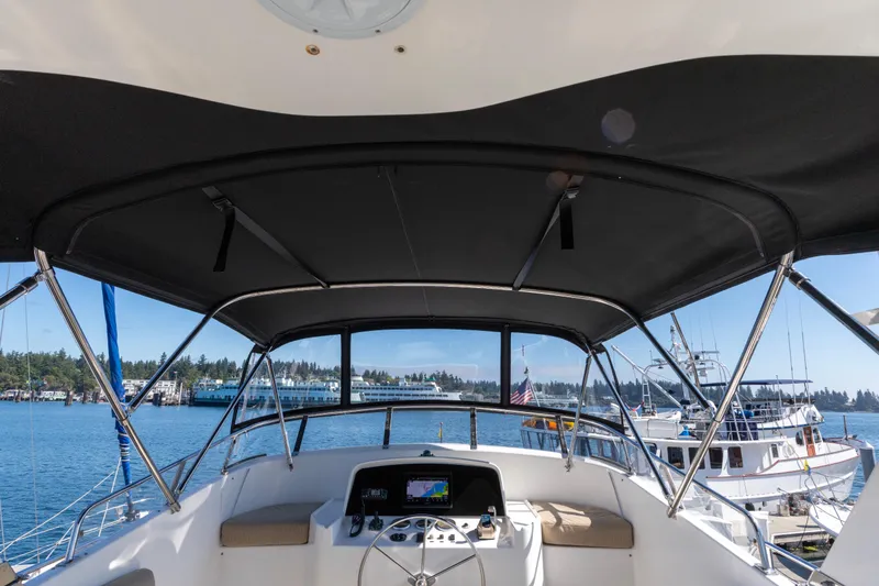 Slide: The Image of Helm of 2006 North Pacific 52 yacht with marina view. - 56