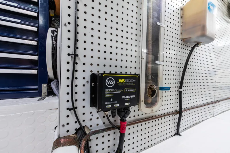 Slide: The Image of Electrical panel and wiring inside a 2006 North Pacific 52 boat, featuring a Wakespeed WS500. - 11