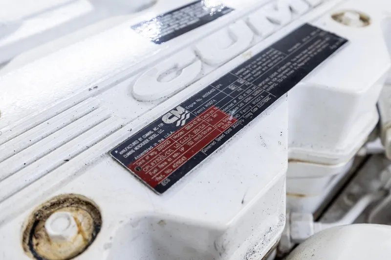 Slide: The Image of Close-up of a Cummins engine label on a 2006 North Pacific 52 yacht. - 12