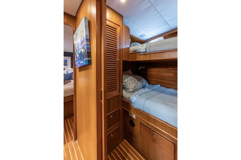 Slide: The Image of Cozy wooden cabin interior with bunk beds on a 2006 North Pacific 52 yacht. - 19