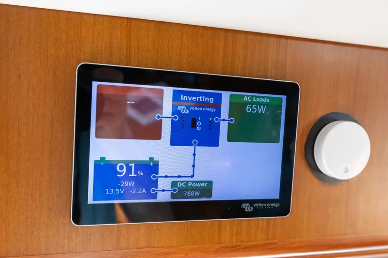 Slide: The Image of Touchscreen display on a 2006 North Pacific 52 yacht showing power management details. - 37