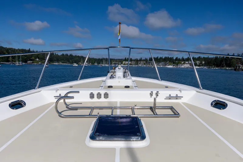 Slide: The Image of Bow view of 2006 North Pacific 52 yacht on calm waters under blue sky. - 46