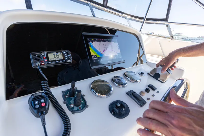 Slide: The Image of Helm of 2006 North Pacific 52 yacht with navigation equipment and controls. - 44