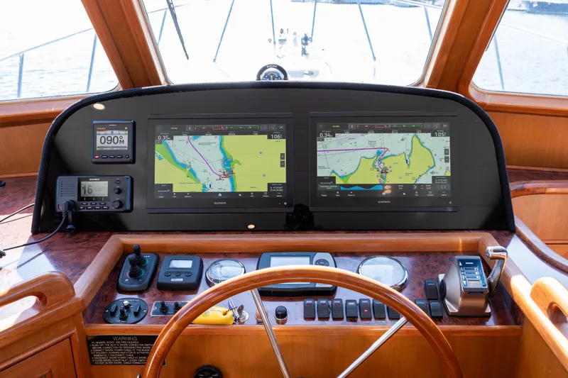 Slide: The Image of Helm of 2006 North Pacific 52 yacht with navigation screens and controls. - 31