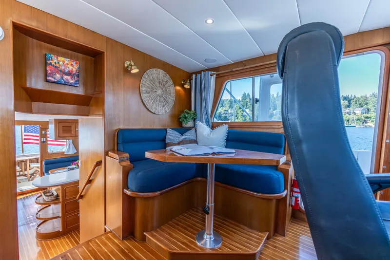 Slide: The Image of Luxurious 2006 North Pacific 52 yacht interior with elegant wood finish and comfortable seating. - 29