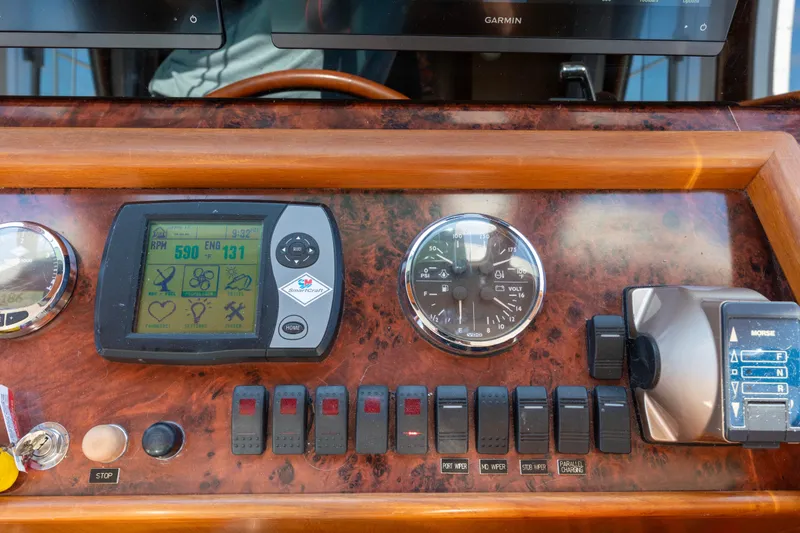 Slide: The Image of Control panel of a 2006 North Pacific 52 boat with gauges and switches. - 33