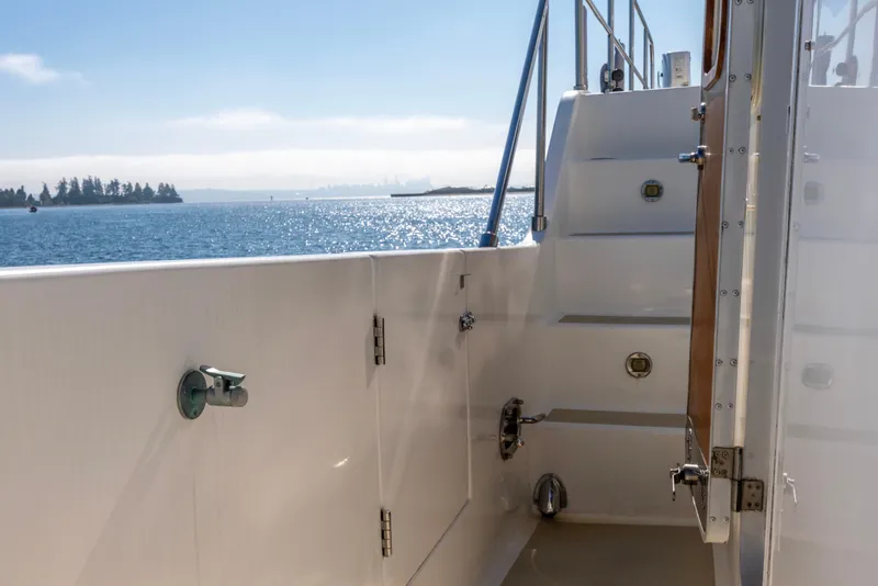 Slide: The Image of 2006 North Pacific 52 yacht deck with ocean view and stairs. - 49