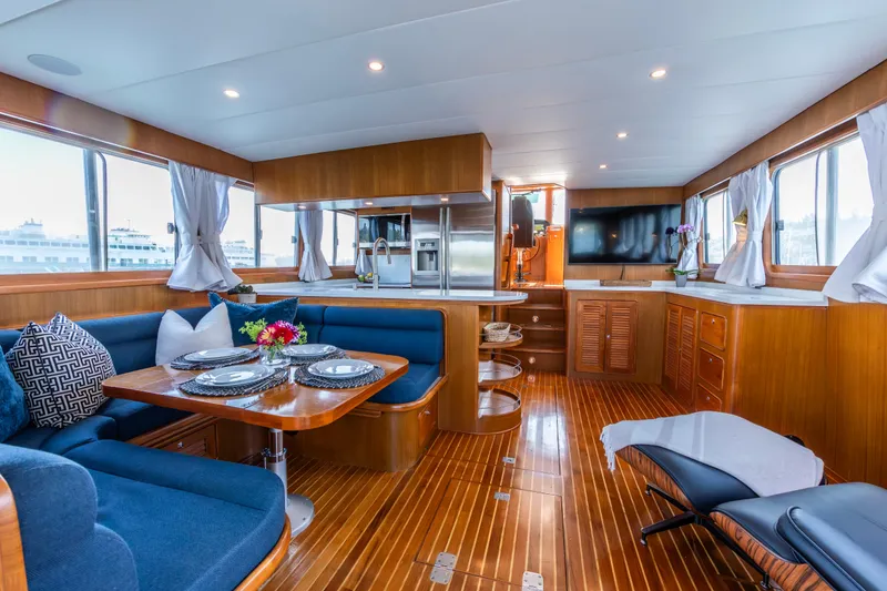 Slide: The Image of Luxurious interior of 2006 North Pacific 52 yacht with elegant dining area and modern kitchen. - 21