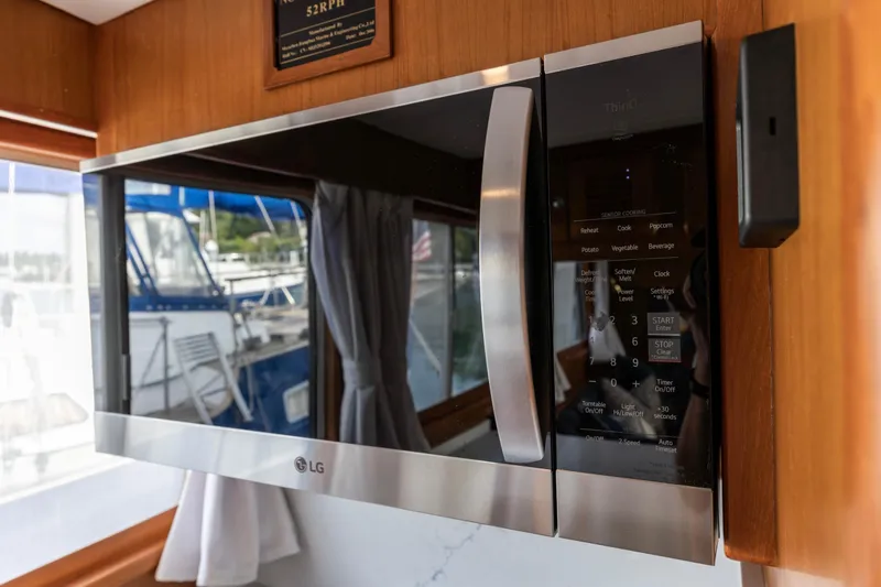 Slide: The Image of LG microwave in a 2006 North Pacific 52 yacht kitchen interior. - 25