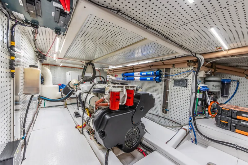 Slide: The Image of Engine room of a 2006 North Pacific 52 yacht, showcasing mechanical systems and components. - 10