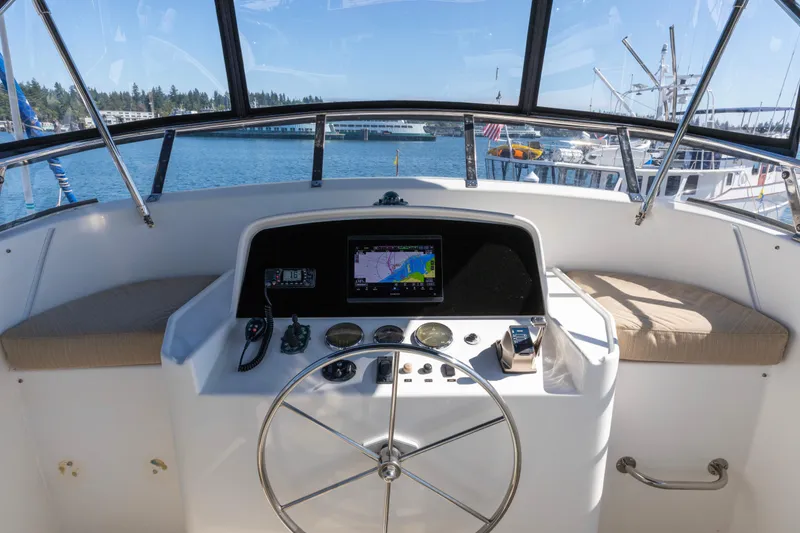 Slide: The Image of Helm of 2006 North Pacific 52 yacht with navigation equipment and steering wheel. - 55