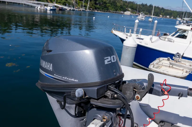 Slide: The Image of Yamaha 20 horsepower four-stroke outboard motor on a 2006 North Pacific 52 boat. - 54