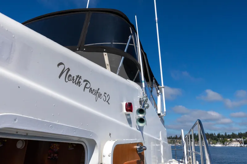 Slide: The Image of 2006 North Pacific 52 yacht against a clear blue sky, showcasing sleek design and elegance. - 41