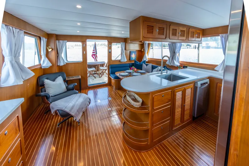 Slide: The Image of Luxurious interior of a 2006 North Pacific 52 yacht with elegant wood finishes and modern amenities. - 22