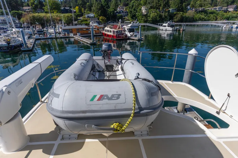 Slide: The Image of Inflatable boat on North Pacific 52 yacht, docked in a scenic marina, 2006 model. - 53