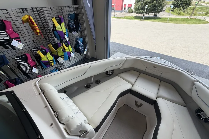 Slide: The Image of Interior of 2021 Regal LS4 Surf boat with life jackets displayed on a rack. - 21