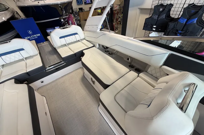 Slide: The Image of Interior of a 2021 Regal LS4 Surf boat with luxurious seating and modern design. - 11
