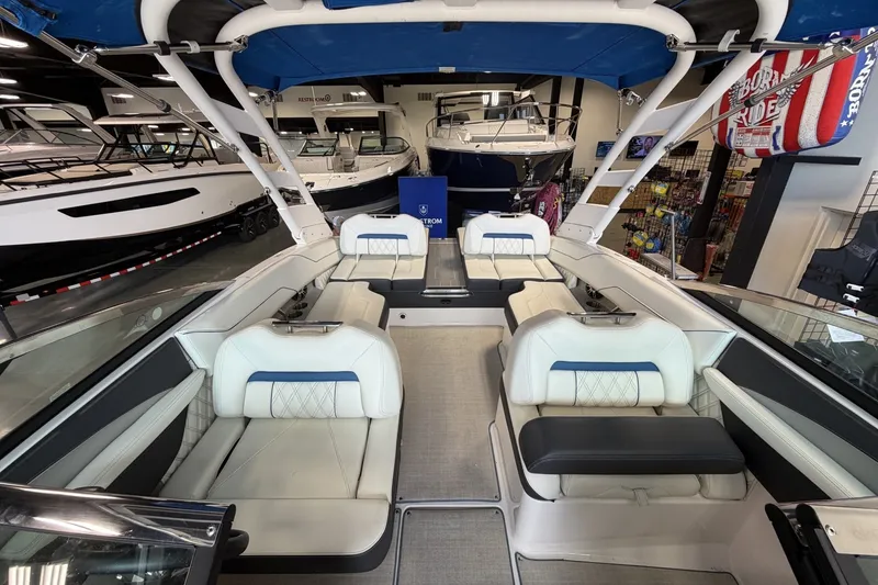 Slide: The Image of Interior view of a 2021 Regal LS4 Surf boat with luxurious seating. - 18
