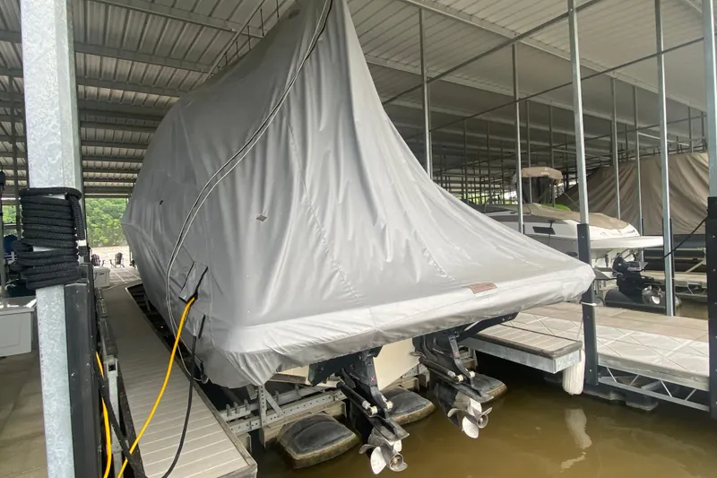 Slide: The Image of Covered 2019 Sea Ray SLX 400 boat docked in a marina. - 60