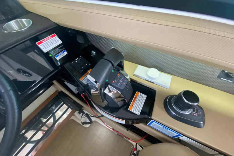 Slide: The Image of Control panel of a 2019 Sea Ray SLX 400 boat with throttle and joystick. - 50