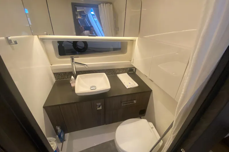 Slide: The Image of Luxurious bathroom interior of 2019 Sea Ray SLX 400 yacht with modern fixtures. - 55