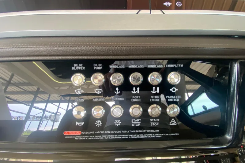Slide: The Image of Control panel of a 2019 Sea Ray SLX 400 boat with various switches and buttons. - 29