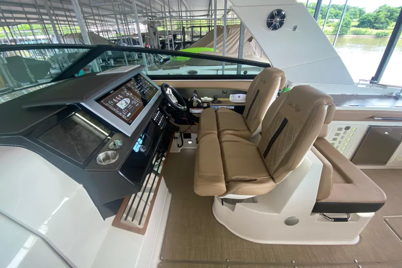 Slide: The Image of 2019 Sea Ray SLX 400 helm with dual seats and advanced navigation system. - 24
