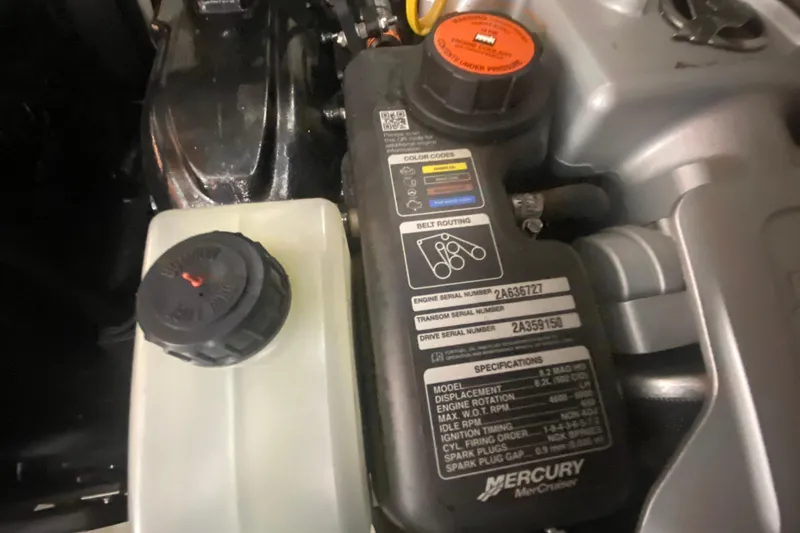 Slide: The Image of Engine compartment of a 2019 Sea Ray SLX 400 with Mercury specifications label. - 42