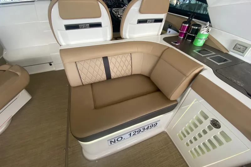 Slide: The Image of Luxurious seating area on a 2019 Sea Ray SLX 400 boat interior. - 21