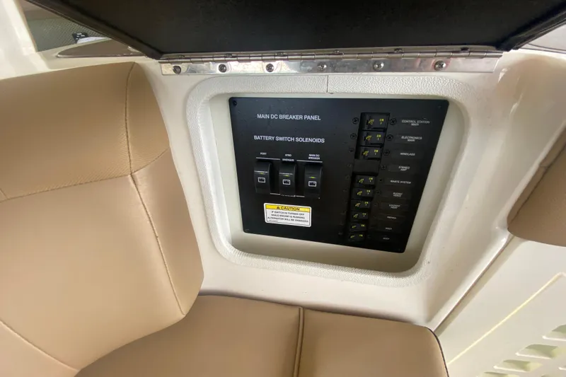 Slide: The Image of 2019 Sea Ray SLX 400 main DC breaker panel with battery switch solenoids. - 20