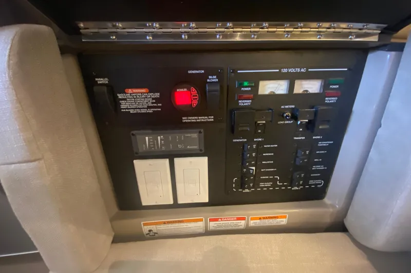 Slide: The Image of Electrical control panel on a 2019 Sea Ray SLX 400 boat. - 51