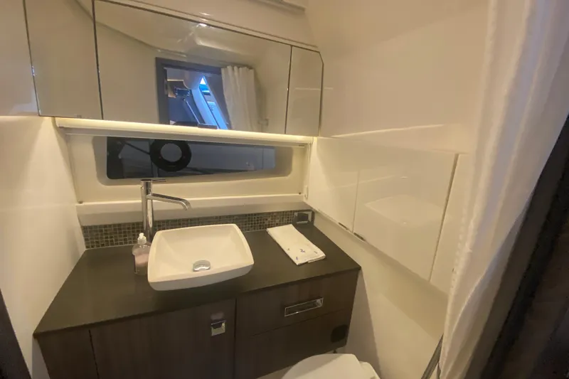Slide: The Image of Luxurious bathroom interior of 2019 Sea Ray SLX 400 yacht with modern sink and mirror. - 41