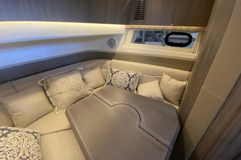 Slide: The Image of Luxurious interior of 2019 Sea Ray SLX 400 yacht with plush seating and cushions. - 35