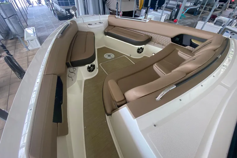 Slide: The Image of 2019 Sea Ray SLX 400 boat interior with luxurious tan seating and spacious layout. - 32