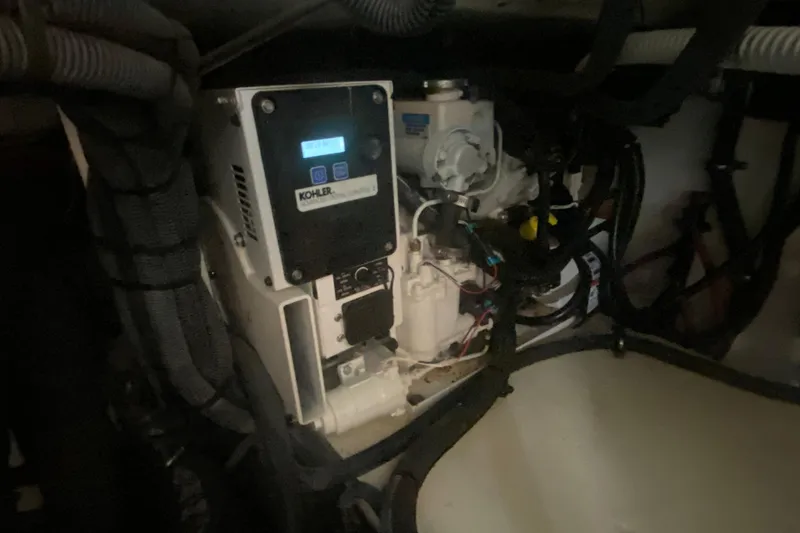 Slide: The Image of Engine compartment of a 2019 Sea Ray SLX 400 boat, featuring a Kohler generator. - 43