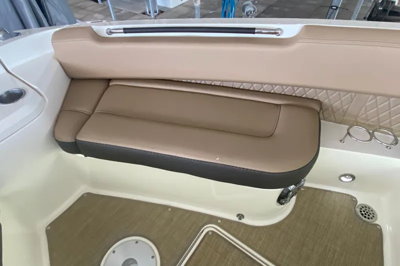 Slide: The Image of Luxurious seating on 2019 Sea Ray SLX 400 boat with tan upholstery and cup holders. - 33