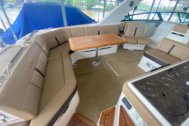 Slide: The Image of Luxurious interior of 2019 Sea Ray SLX 400 boat with elegant seating and table. - 17