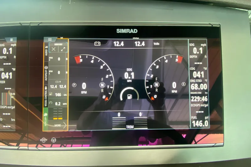Slide: The Image of Simrad display on 2019 Sea Ray SLX 400 showing navigation and engine data. - 27
