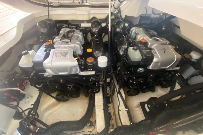 Slide: The Image of Twin engines in a 2019 Sea Ray SLX 400 boat, showcasing powerful marine engineering. - 56