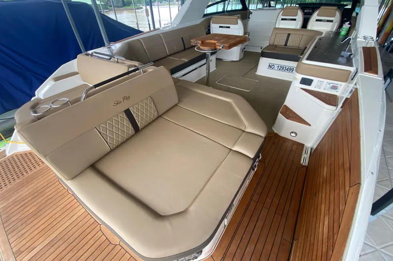 Slide: The Image of Luxurious interior of 2019 Sea Ray SLX 400 boat with elegant seating and wood accents. - 12