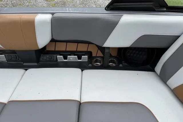 Slide: The Image of 2022 Malibu Wakesetter 23 MXZ interior with stylish gray and brown seating. - 29