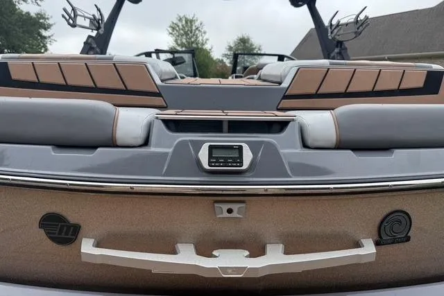 Slide: The Image of 2022 Malibu Wakesetter 23 MXZ boat rear view with sleek design and modern features. - 12