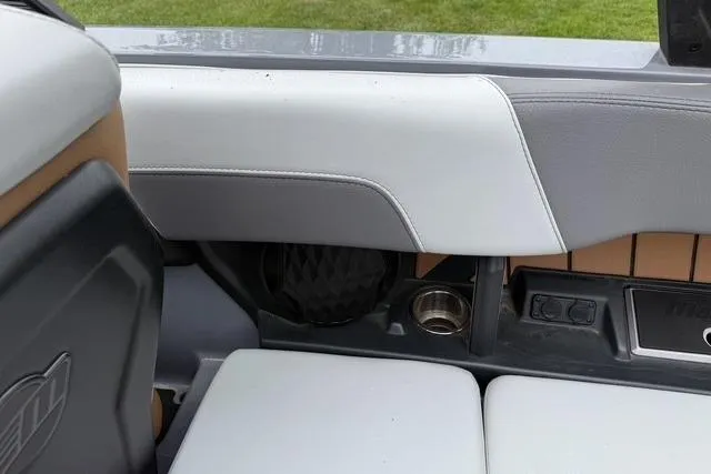 Slide: The Image of Interior of 2022 Malibu Wakesetter 23 MXZ boat, featuring seating and speaker details. - 32