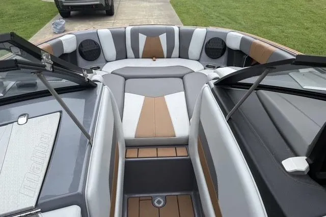Slide: The Image of 2022 Malibu Wakesetter 23 MXZ boat interior with stylish seating and modern design. - 23