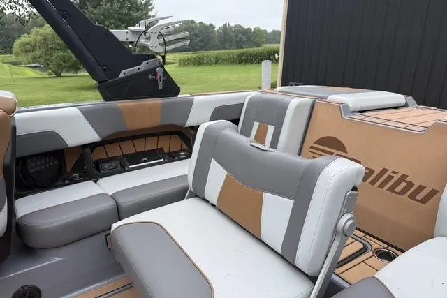 Slide: The Image of 2022 Malibu Wakesetter 23 MXZ interior with stylish seating and modern design. - 11