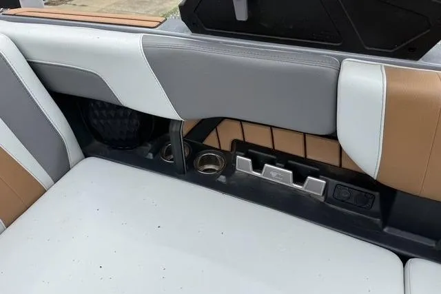 Slide: The Image of 2022 Malibu Wakesetter 23 MXZ interior with sleek seating and cup holders. - 30