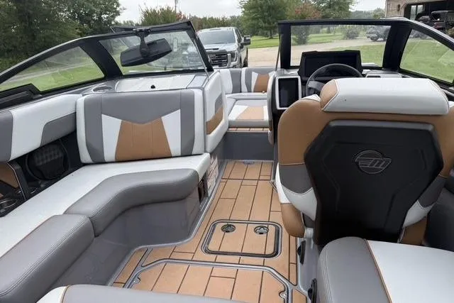 Slide: The Image of 2022 Malibu Wakesetter 23 MXZ interior with luxurious seating and modern dashboard design. - 16
